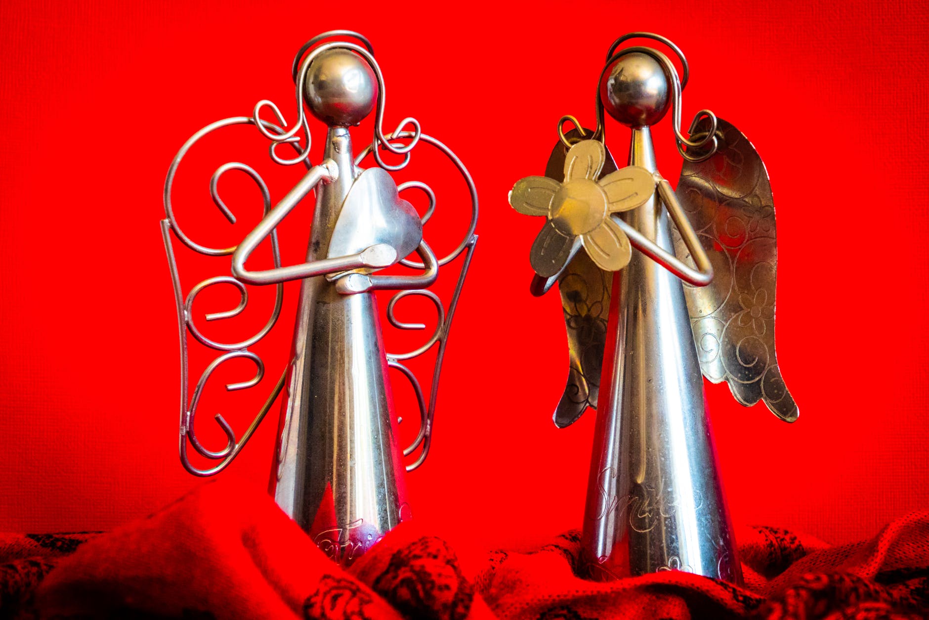 two silver angel figurines